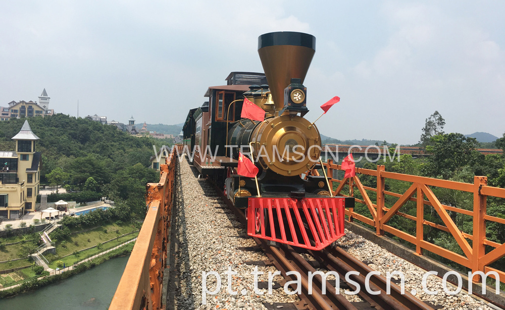 sightseeing train red and yellow colours on bridge